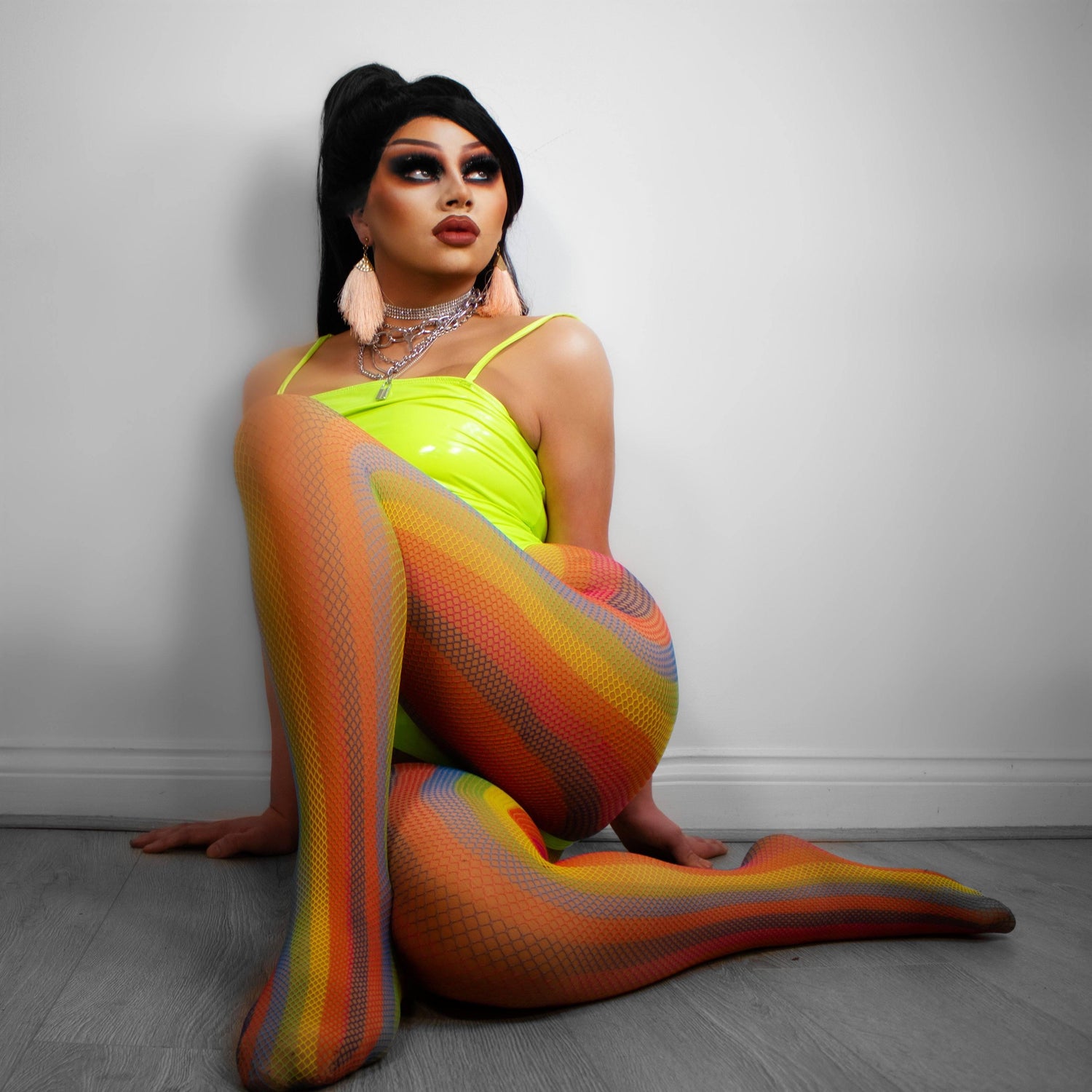 Model wearing rainbow coloured fishnets