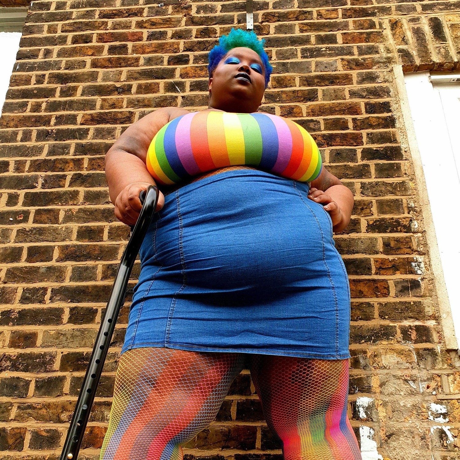 Model wearing rainbow coloured fishnets